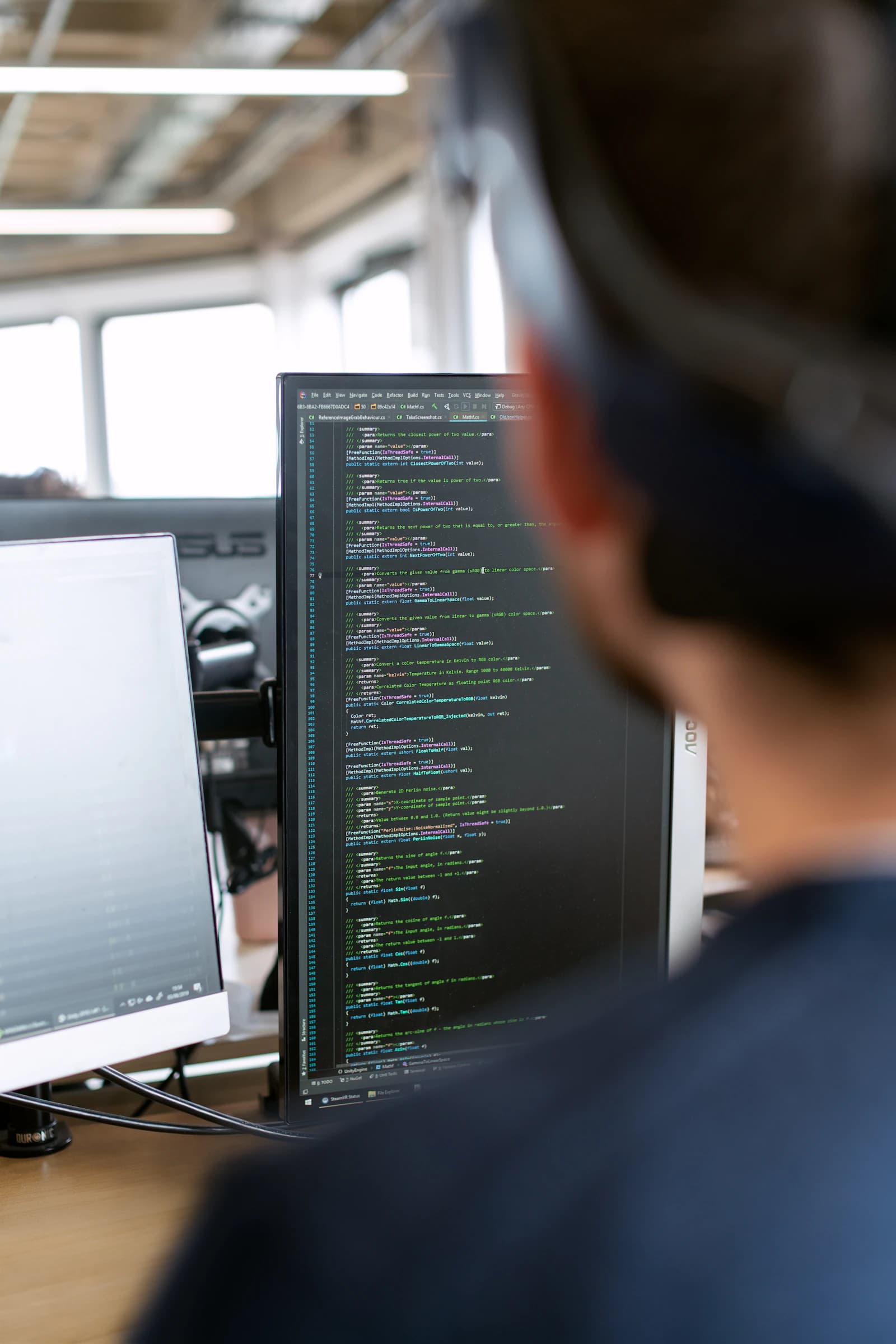 A database administrator reviewing privileged query activity and access logs on screen
